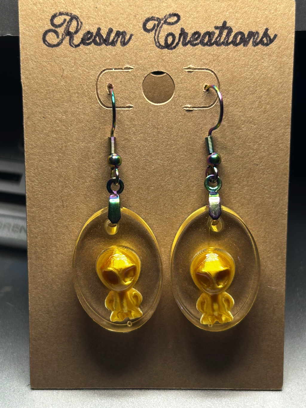 Gold Oval Aliens Earrings
